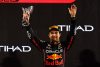 ABU DHABI, UNITED ARAB EMIRATES - NOVEMBER 20: Third placed Sergio Perez of Mexico and Oracle Red Bull Racing celebrate on the podium during the F1 Grand Prix of Abu Dhabi at Yas Marina Circuit on November 20, 2022 in Abu Dhabi, United Arab Emirates. (Photo by Rudy Carezzevoli/Getty Images) // Getty Images / Red Bull Content Pool // SI202211202812 // Usage for editorial use only //